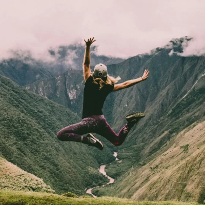 Person jumping in joy, much like you might when you get rid of migraines!