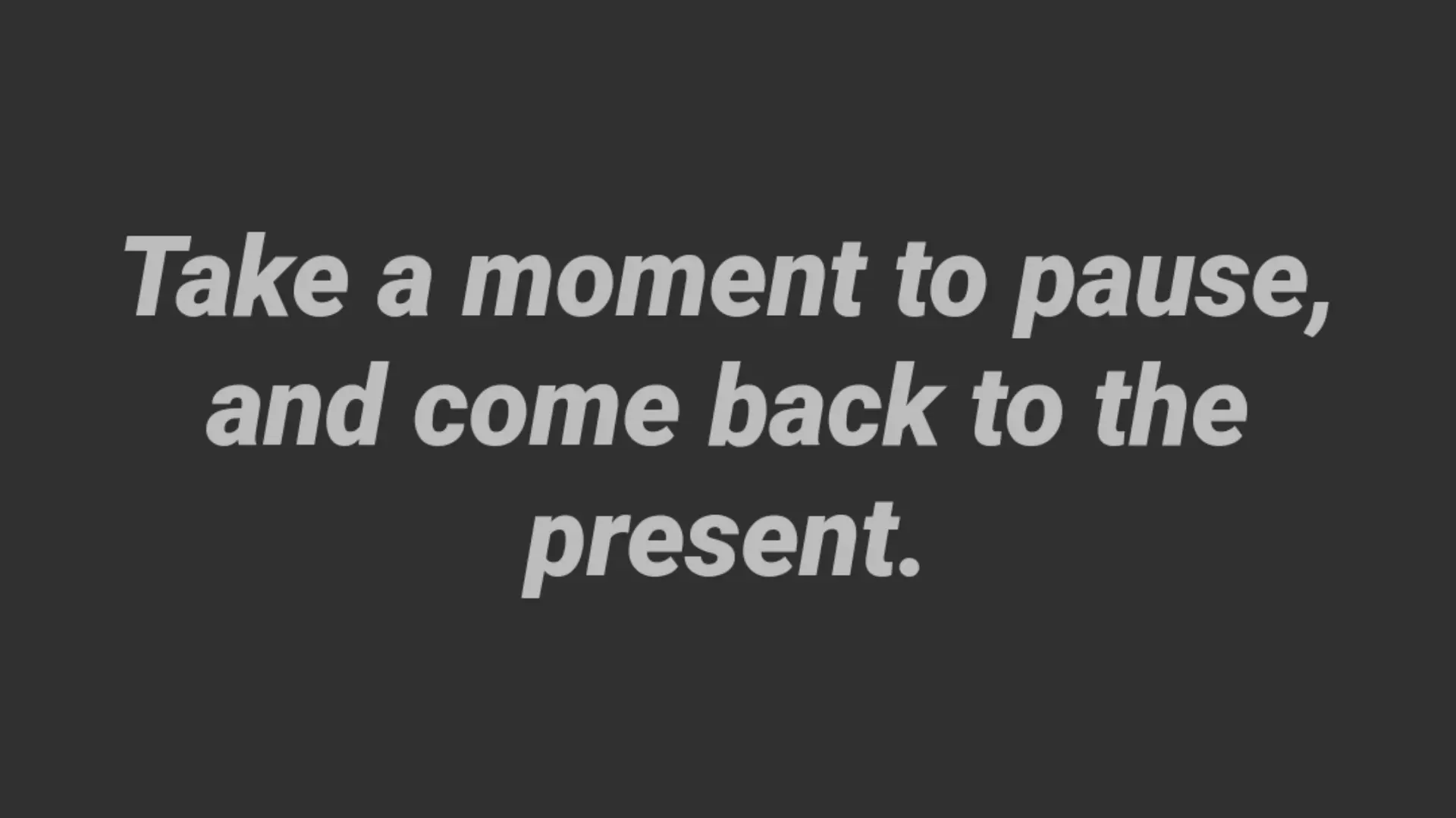 A reminder from the Mindful Notifier app that reads "Take a moment to pause, and come back to the present."