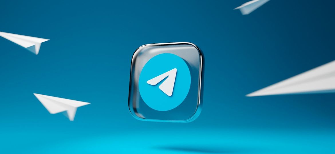 a blue button with a white arrow on it, Telegram's logo